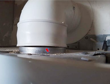 Poorly fitted boiler flue showing gap between flue and boiler