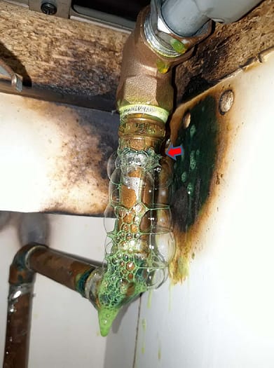 Gas pipework with leak detection fluid at joints showing that pipework is not sealed correctly