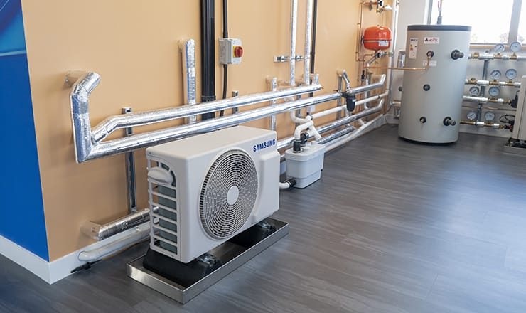 A heat pump and hot water cylinder in Samsung's new Manchester training centre