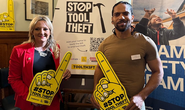 MP Amanda Martin stands next to TV personality Robert Bent. Both are holding placards that read STOP TOOL THEFT. Photo taken at the Houses of Parliament